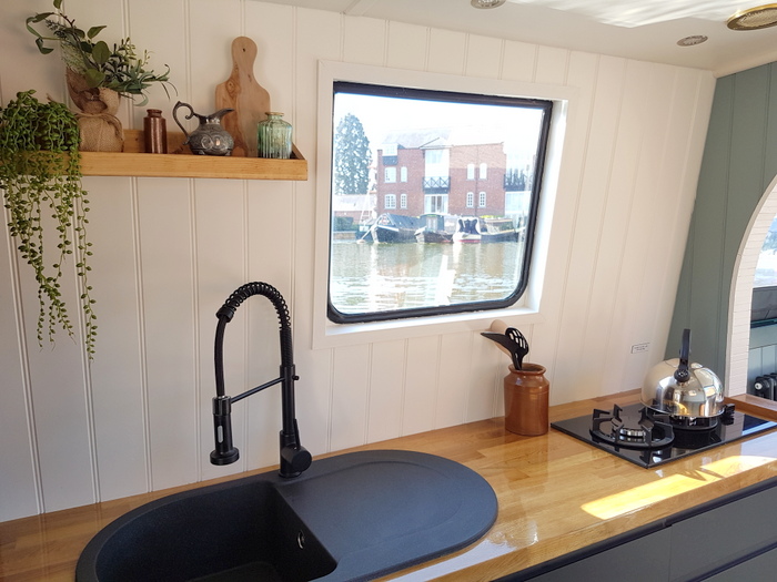 Kitchen on electric Boutique Narrowboat in Market Harborough