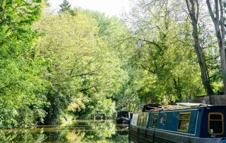 View of the canal from the front of a Union Wharf Narrowboat for hire