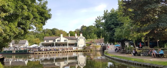 The scenery when cruising on the Foxton, Welford and Return 3-night route with Union Wharf narrowboat hire. A view of Foxton Locks and the Foxton Locks Inn from the basin of the canal.