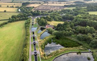 Aerial drone shot of Foxton Locks, near Market Harborough, by Union Wharf Narrowboats. One of the top 5 narrowboat destinations in Leicestershire.
